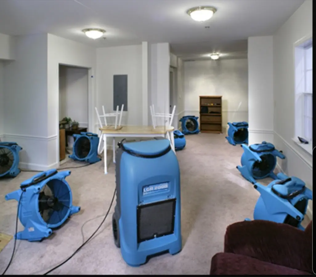 Air movers and dehumidifier setup for Water Damage Restoration in Cheval